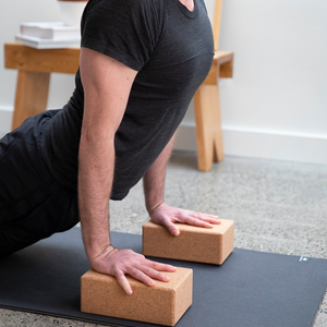 Person using two yoga blocks